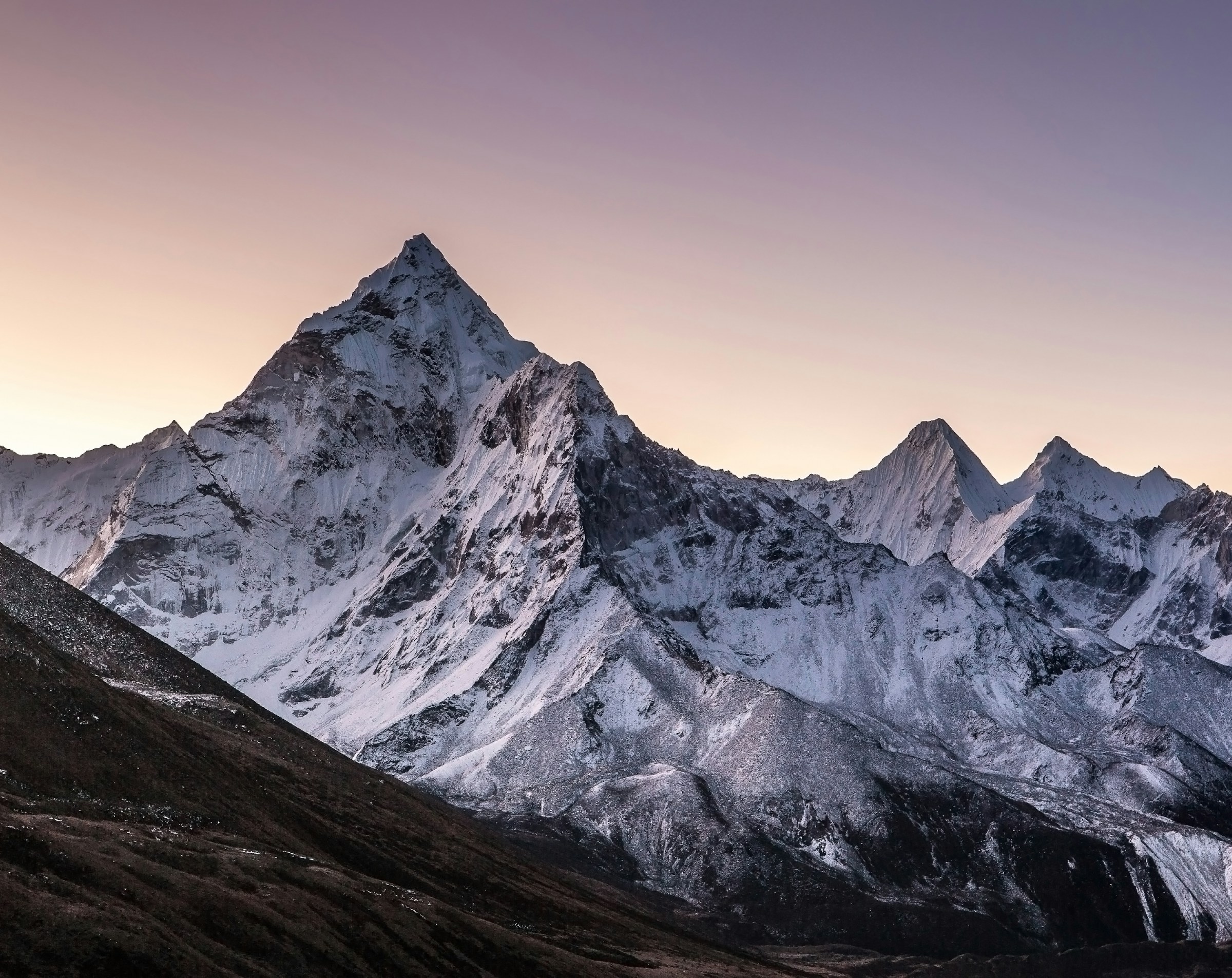 A towering summit at dusk — the emblem of Vinson Global Holdings